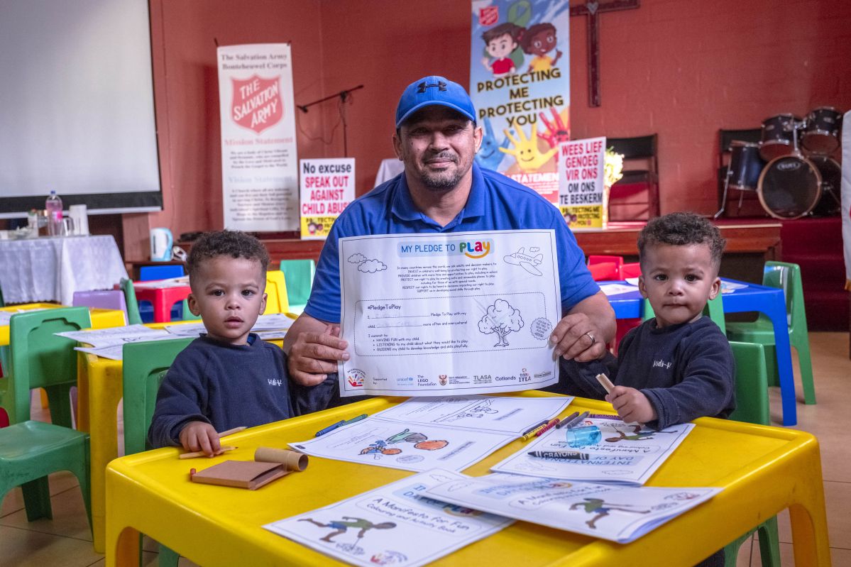 A father and little babies at an ECD Centre