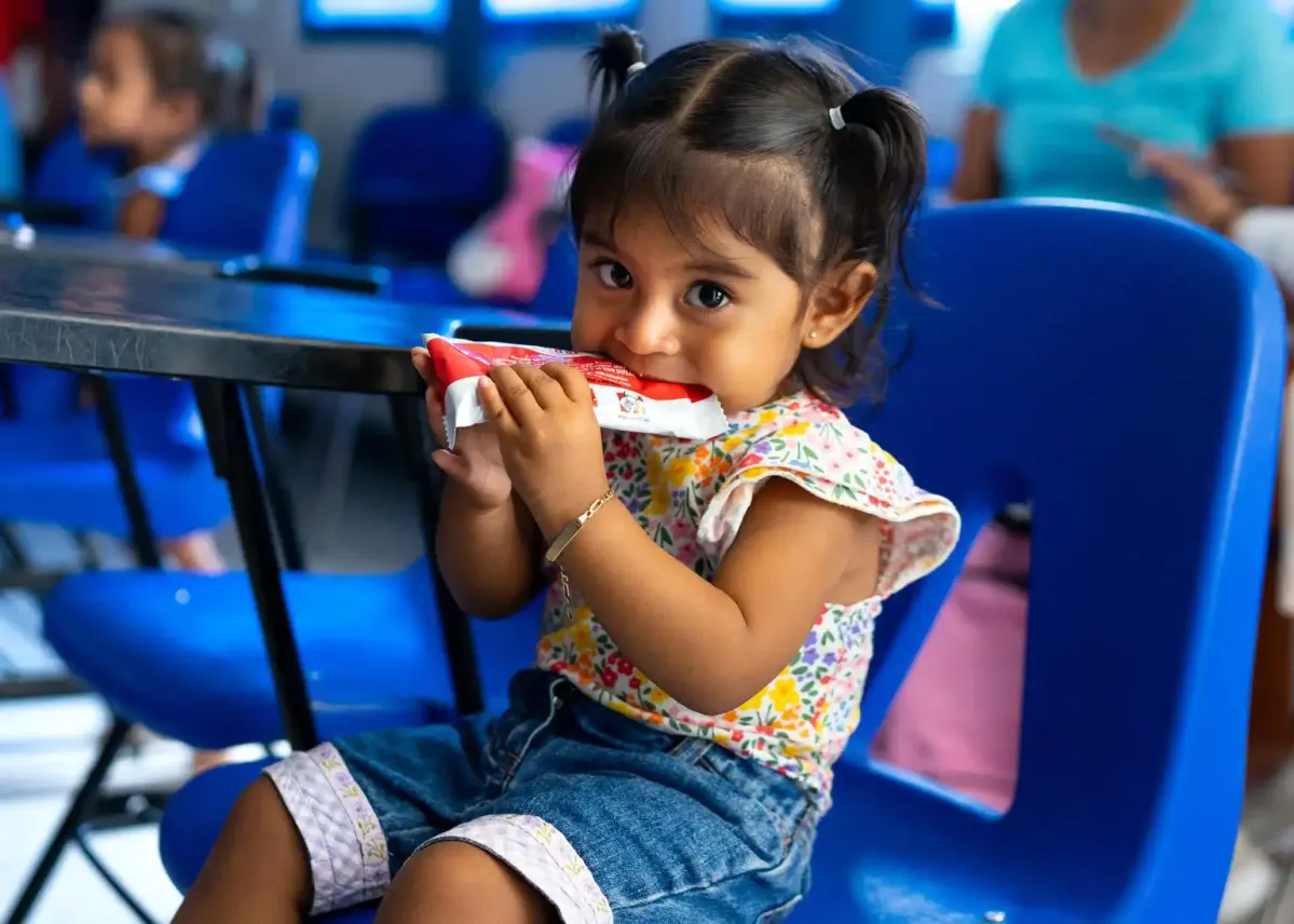 Girl eating in classroom