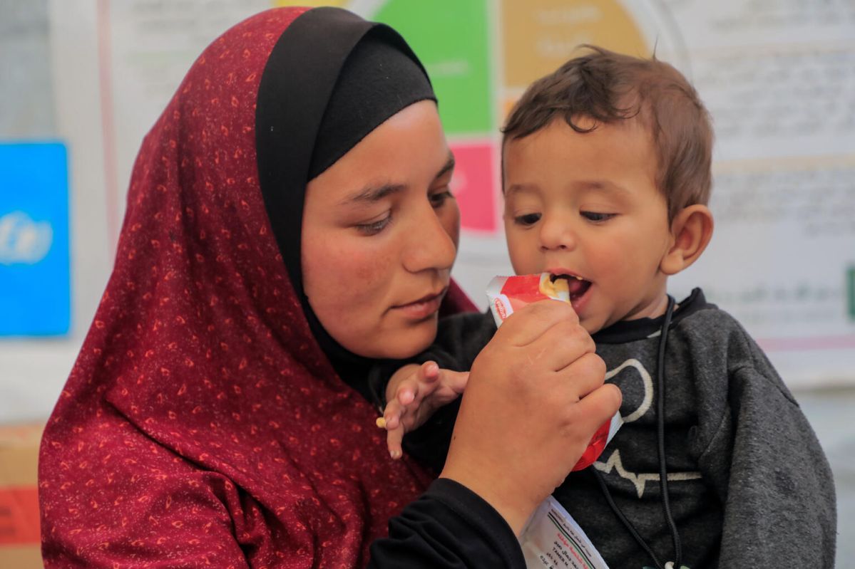 Mother feeding child
