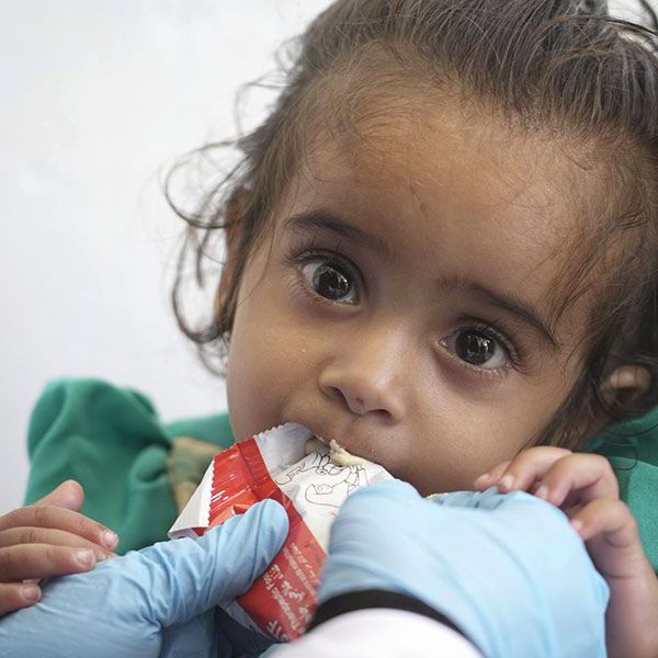 Maram Adel Yahya is being fed with therapeutic food 