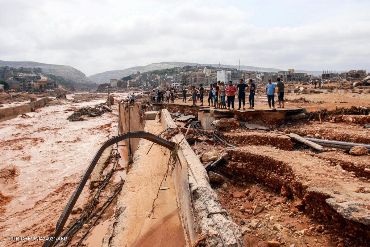 People survey damage caused by floods in Derna, northeastern Libya, on Sept. 11, 2023. © UNICEF/UNI434931/AFP 