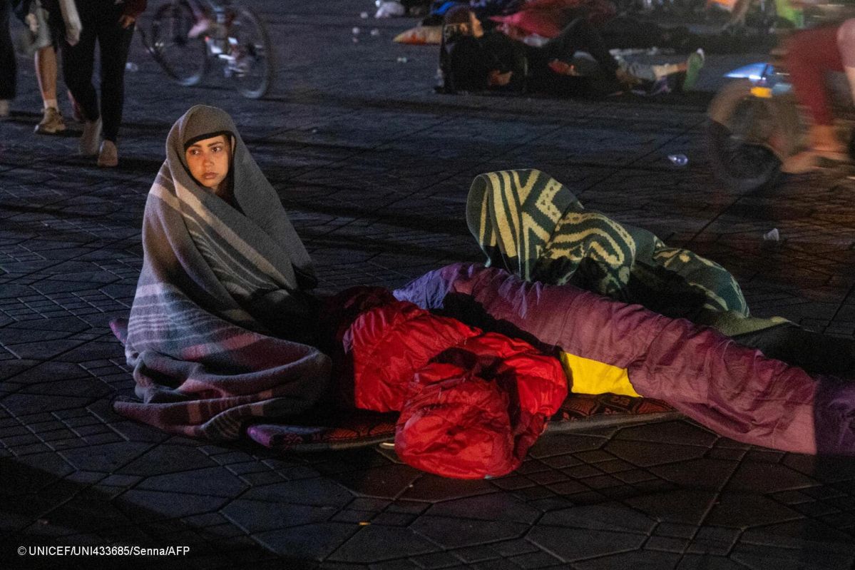 Residents stay out at a square following an earthquake in Marrakesh on September 9, 2023. Nearly 300 people were killed after a powerful earthquake rattled Morocco on September 8 night, according to a preliminary government count, with Marrakesh residents reporting "unbearable" screams followed the 6.8-magnitude quake. (Photo by FADEL SENNA / AFP)