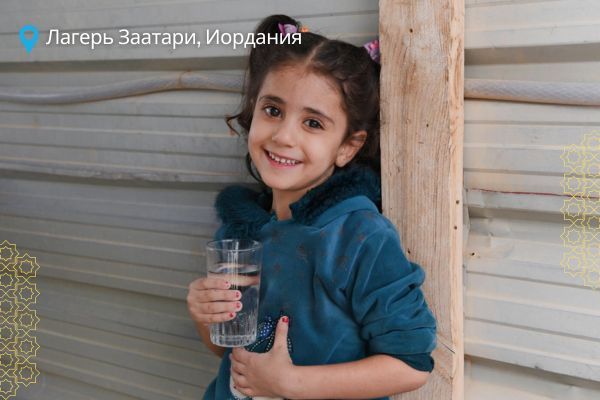 Shahd, 5, drinks water at home in Za'atari refugee camp.