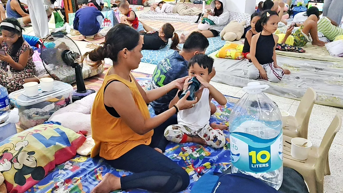 Children and families take shelter in evacuation centers