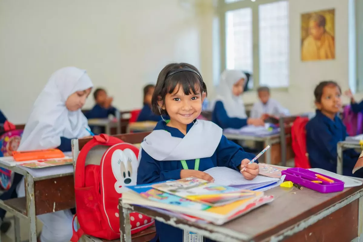 Girl called Hurain smiling and looking to camera