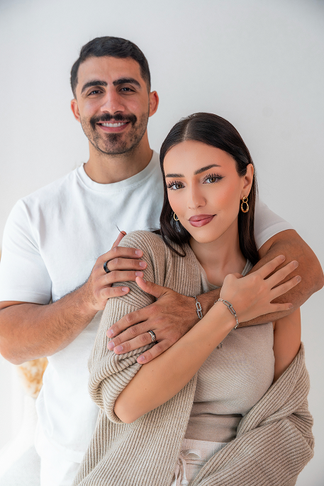 Nora and Khalid wearing UNICEF Promise Bracelet