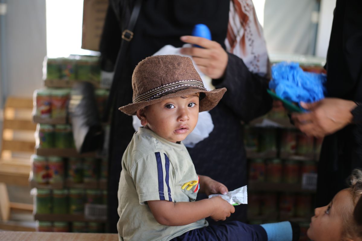 Child in palestine receiving RUTF from UNICEF