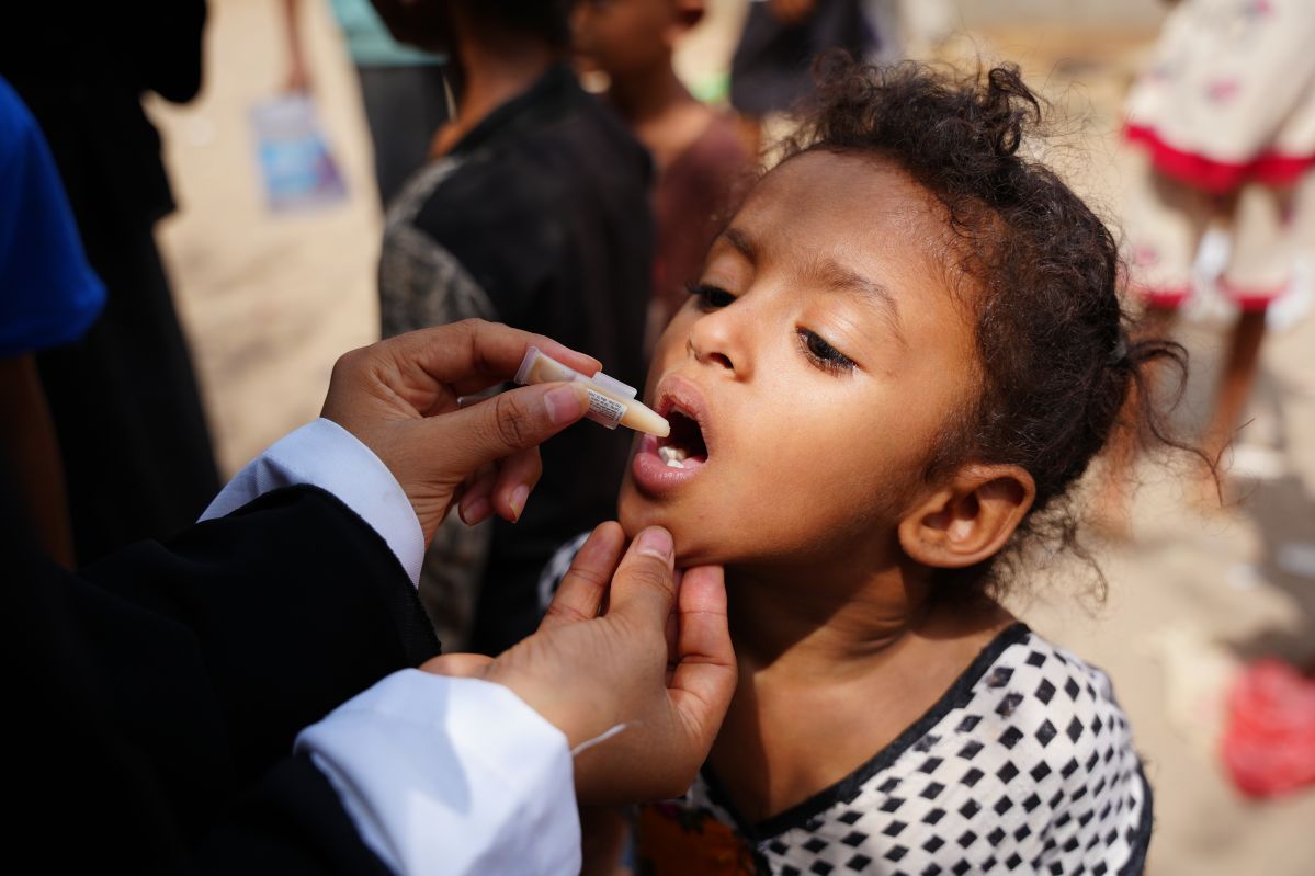 Child being offered medication at UNIVEF facility