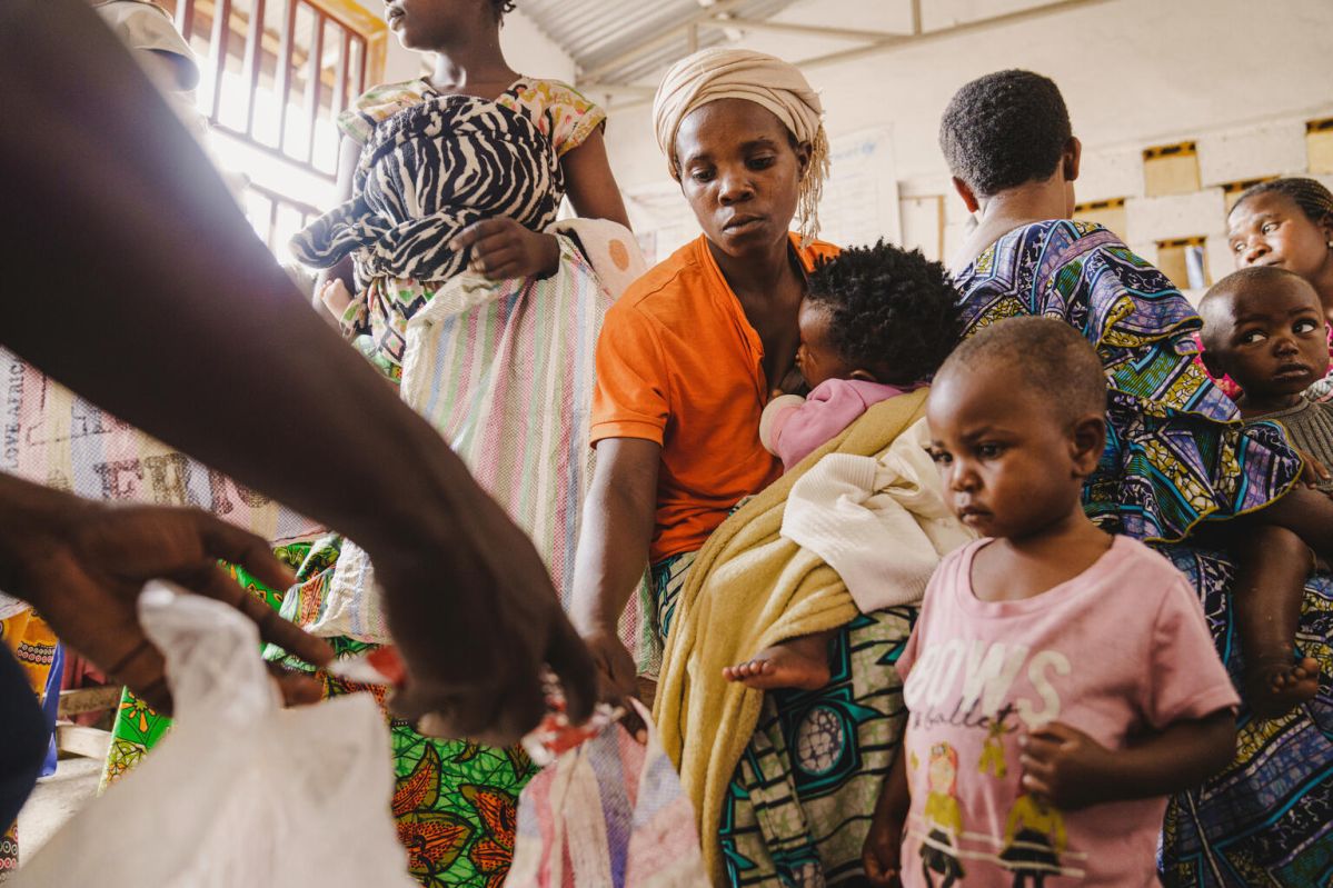 Alice Chirimwami receives ready-to-use therapeutic food for her 2-year-old daughter, Charmante, as she is weighed at the Umoja Health Centre in Goma, North Kivu Province, DRC (11 September 2025) 