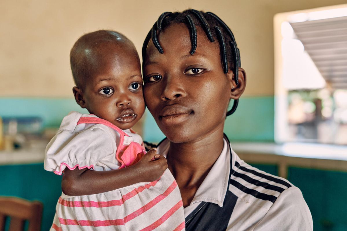 A close up of a mother holding her baby